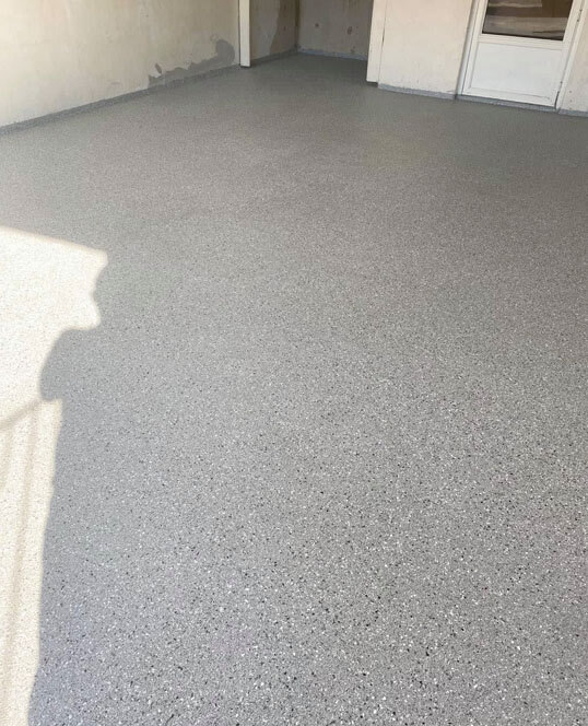 Finished garage floor with epoxy coating